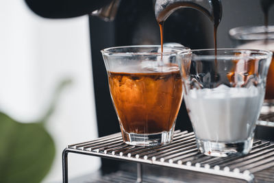 Close-up of coffee in glass on table