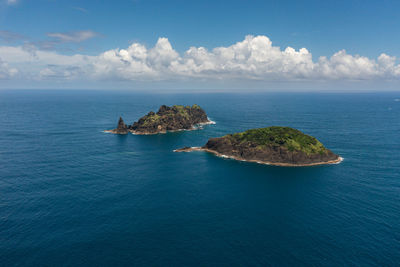 Top view of tropical island and blue sea. dos hermanos island. santa ana, cagayan. philippines.