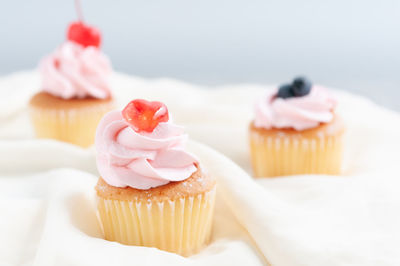 Close-up of cupcakes on cake