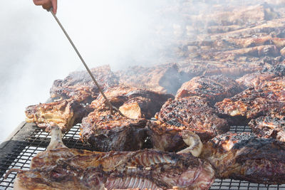 High angle view of meat on barbecue grill