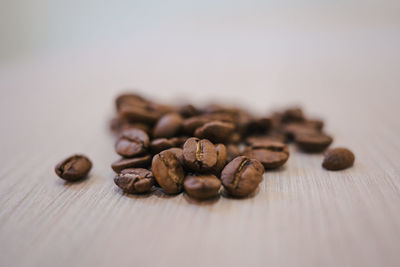 Close-up of coffee beans on table