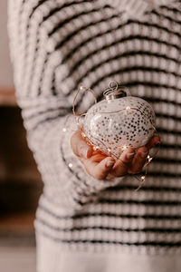 Close-up of woman holding leaf