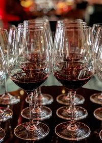 Close-up of wine glasses on table