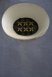 Close-up of circular object on wall