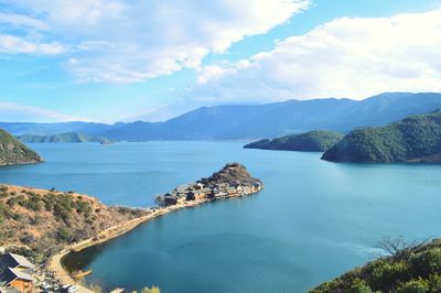 Scenic view of mountains against cloudy sky