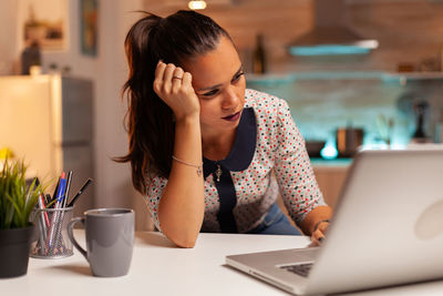 Businesswoman working at laptop