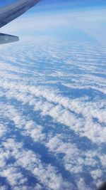 Aerial view of landscape against cloudy sky