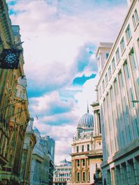 Low angle view of building against cloudy sky