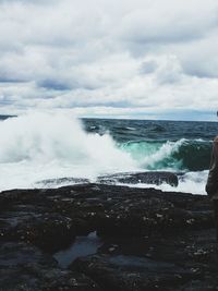 Scenic view of sea against cloudy sky