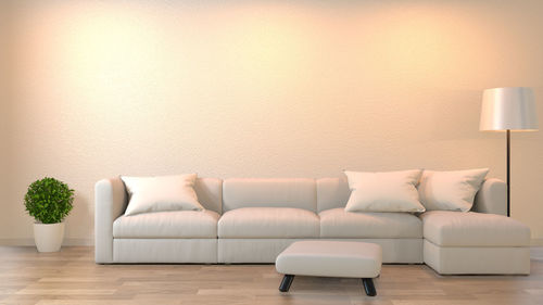 Sofa against white wall at home