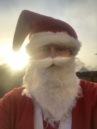 Close-up portrait of young man wearing hat