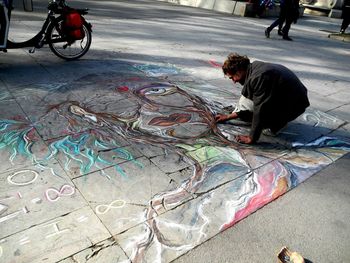 High angle view of man with bicycle on street