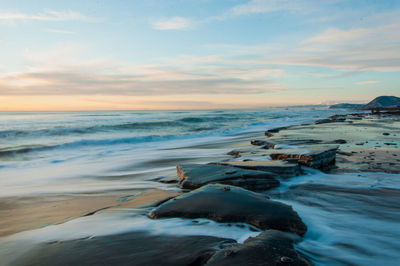 Scenic view of beach against sky