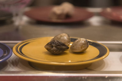 Close-up of mussels served in plate on table