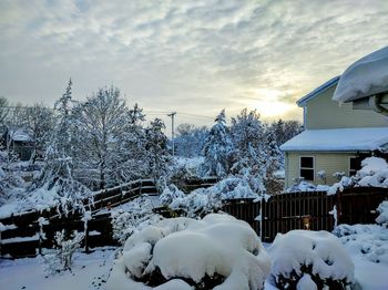 Snow covered landscape at sunset