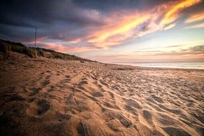 Scenic view of sea against cloudy sky