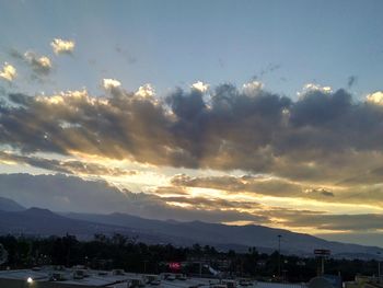 Scenic view of mountains against sky at sunset