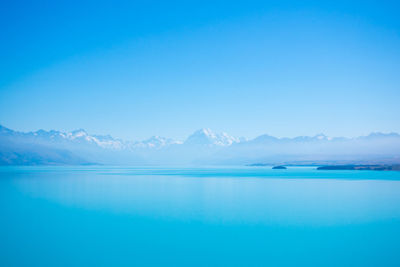 Scenic view of mountains against clear blue sky