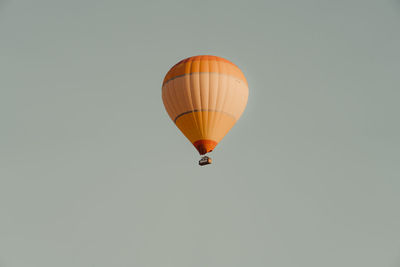 Low angle view of hot air balloon against clear sky