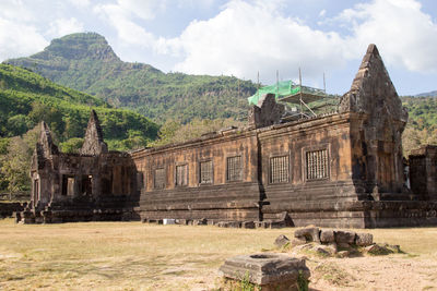 Old temple against cloudy sky