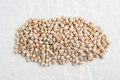 Close-up of roasted coffee beans on table