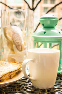 Close-up of coffee cup on table