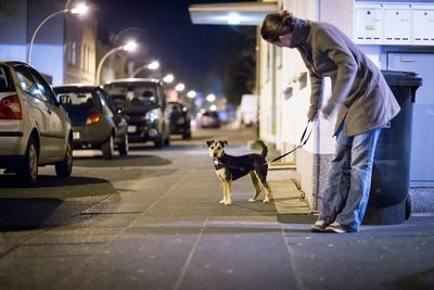 People walking on road in city