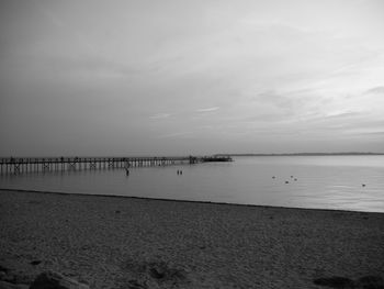 Scenic view of sea against sky at dusk