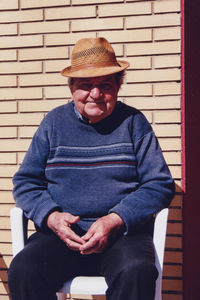 My grandpa primo, sitting on his porch in a sunny day