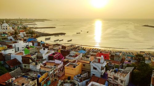 High angle view of beach against sky during sunset