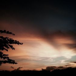 Low angle view of cloudy sky at sunset