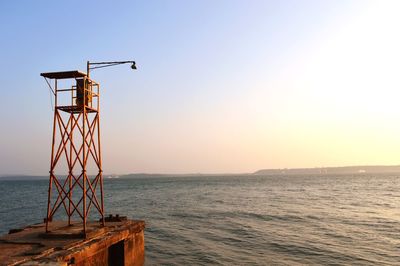 Lifeguard hut on sea against clear sky