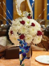 Close-up of flower vase on table