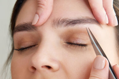 Woman getting eyebrows done