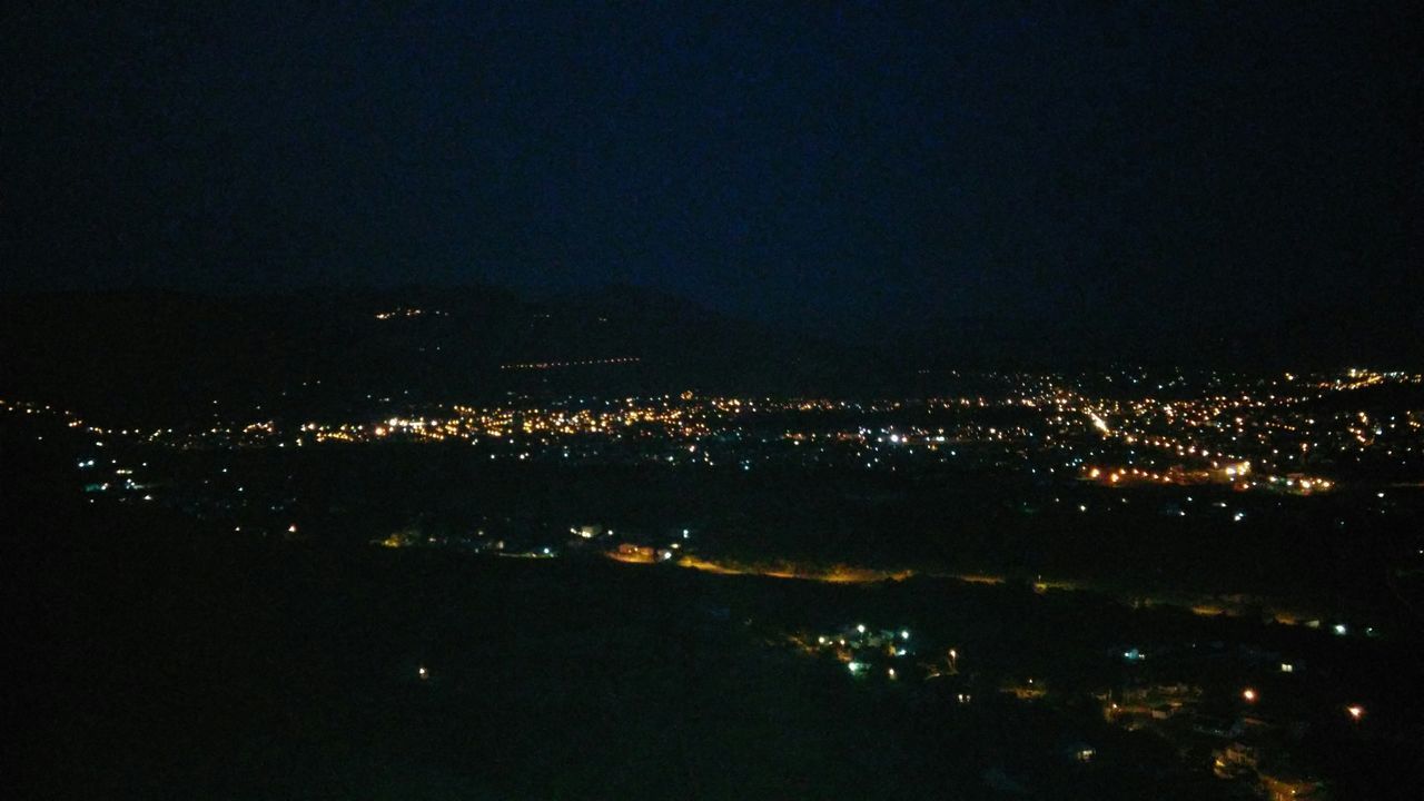 night, illuminated, cityscape, city, aerial view, copy space, high angle view, crowded, building exterior, dark, architecture, built structure, sky, residential district, clear sky, landscape, light, no people, city life, outdoors