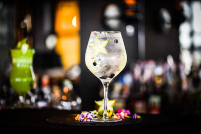 Tonic gin beverage with fresh fruits and spices
