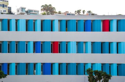 Multi colored built structure against blue sky