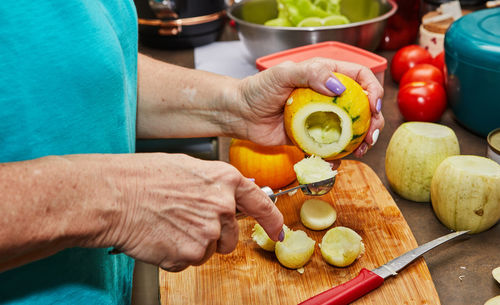 Midsection of man preparing food