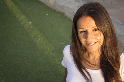 Portrait of smiling woman standing outdoors