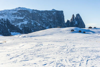 Alpe di siusi allo sciliar, alpine plateau in the dolomites. stunning sunsets in the snow