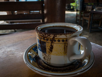 Close-up of coffee cup on table