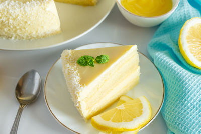 Lemon cake with coconut flakes. a piece of delicate vanilla dessert with cream.