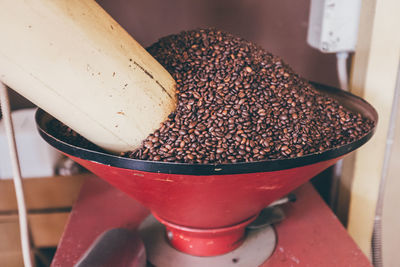 High angle view of roasted coffee beans in machine