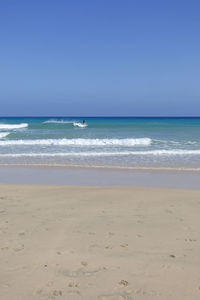 Scenic view of sea against clear sky