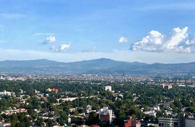 High angle view of buildings in city against sky