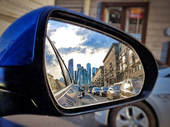 Reflection of sky on side-view mirror