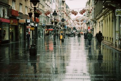 People walking on water in city