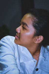 Portrait of smiling young man looking away