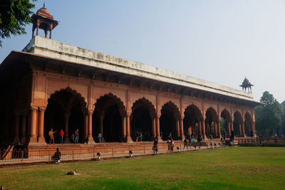 Group of people in front of historical building