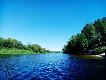 Scenic view of calm sea against clear blue sky